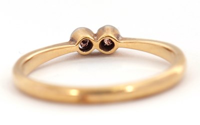 Lot 59 - A two stone diamond ring, set with two old...