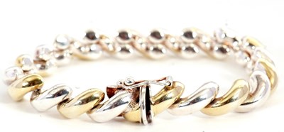 Lot 238 - A two tone silver bracelet, with twist style...