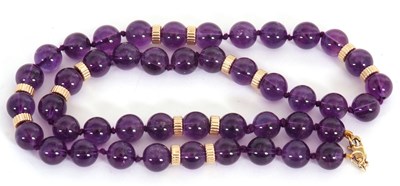 Lot 177 - A 9ct amethyst bead necklace, the round...