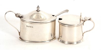 Lot 8 - Two George V silver mustard pots, a plain oval...