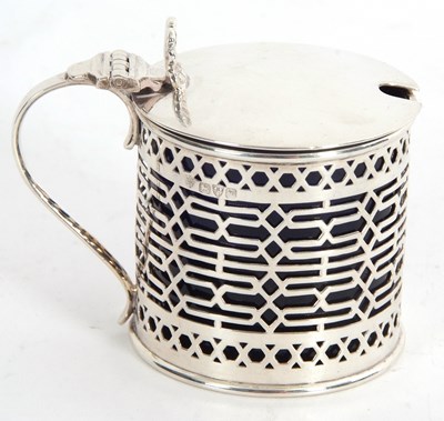 Lot 9 - An Edwardian silver mustard pot and blue glass...