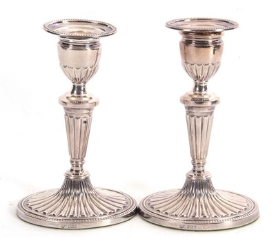 Lot 14 - A pair of Elizabeth II silver candlesticks in...