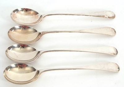 Lot 15 - Four George V silver Old English pattern soup...