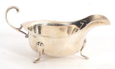 Lot 27 - A George V silver sauce boat of typical form,...