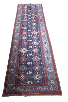 Lot 421 - A Caucasian runner carpet decorated with a...