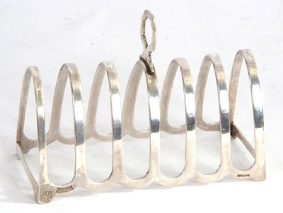 Lot 47 - An Elizabeth II silver toast rack of seven...