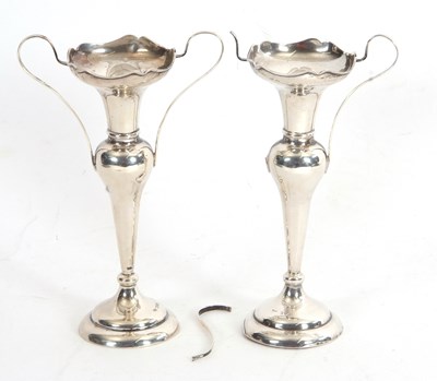 Lot 52 - A pair of Edwardian silver twin handled vases...