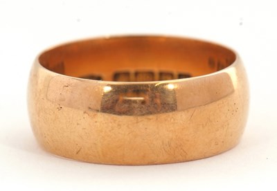 Lot 194 - An 18ct wedding band, the 8.7mm wide band...