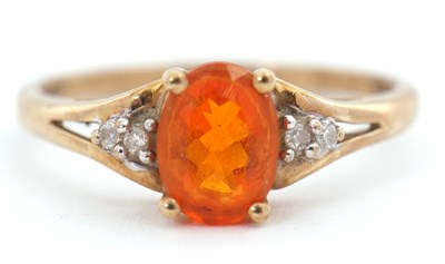 Lot 99 - A 9ct fire opal and diamond ring, the oval...