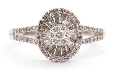 Lot 94 - A 9ct diamond ring, set throughout with round...