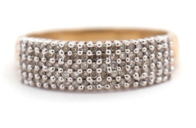 Lot 104 - A 9ct diamond ring, set with small round...
