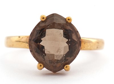 Lot 13 - A 9ct smokey quartz ring, the modified cushion...