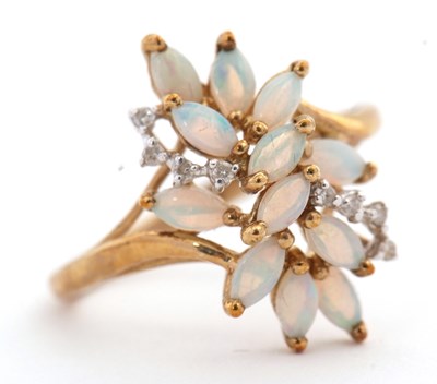 Lot 15 - A 9ct opal and diamond cluster ring, set wtih...