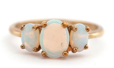 Lot 8 - A 9ct opal ring, the three graduated oval opal...