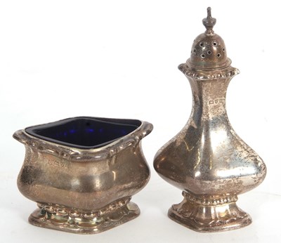 Lot 80 - An Edwardian silver pepper and matching salt...
