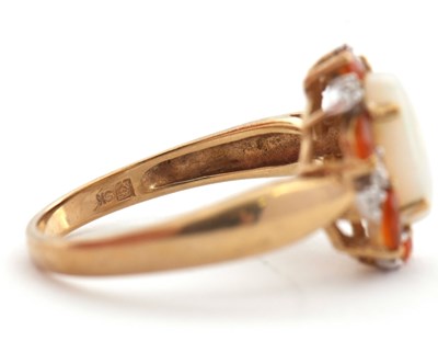 Lot 23 - A 9ct opal, fire opal and diamond ring, the...