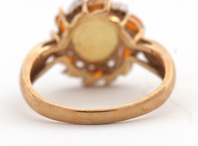 Lot 23 - A 9ct opal, fire opal and diamond ring, the...
