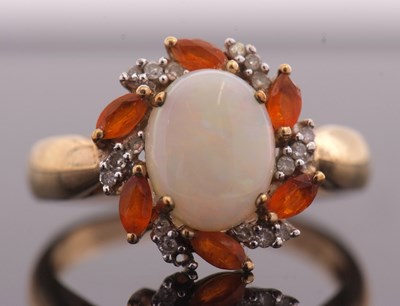 Lot 23 - A 9ct opal, fire opal and diamond ring, the...