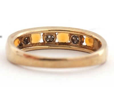 Lot 30 - A 9ct fire opal and diamond ring, the half...