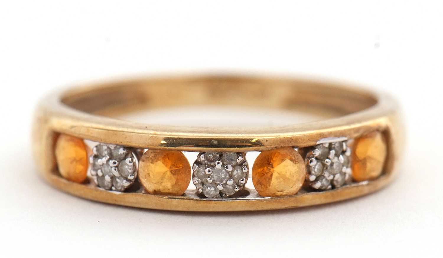 Lot 30 - A 9ct fire opal and diamond ring, the half...