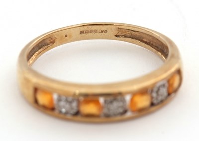 Lot 30 - A 9ct fire opal and diamond ring, the half...