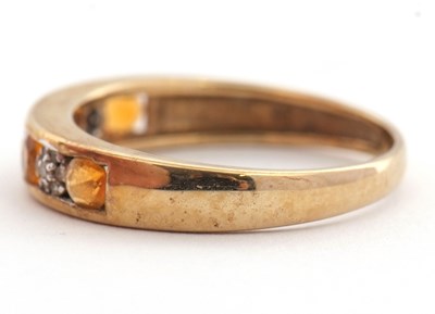 Lot 30 - A 9ct fire opal and diamond ring, the half...