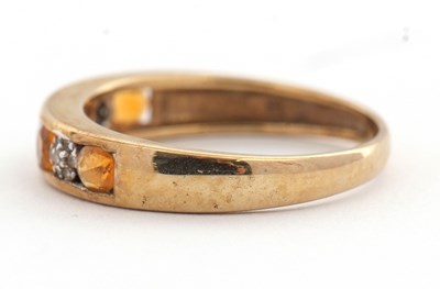 Lot 30 - A 9ct fire opal and diamond ring, the half...