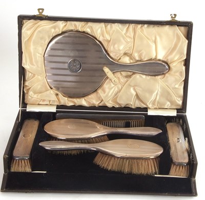 Lot 100 - An Art Deco six piece silver backed dressing...