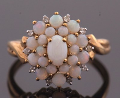 Lot 2 - A 9ct opal cluster ring, set with a mix of...