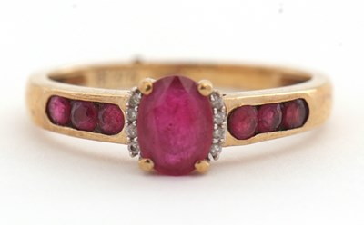 Lot 37 - A 9ct ruby and diamond ring, with central oval...