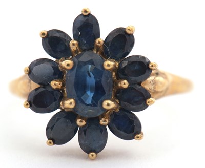 Lot 6 - A 9ct sapphire cluster ring, set throughout...