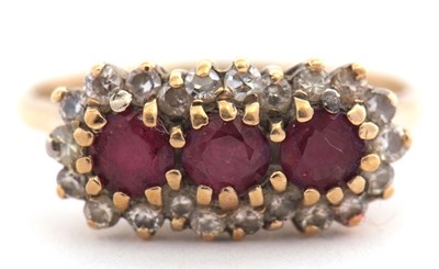 Lot 38 - A 9ct ruby and diamond ring, set with three...
