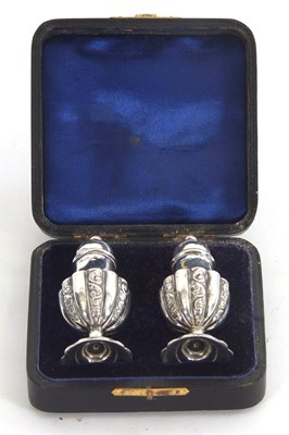 Lot 117 - A cased pair of Victorian urn shaped silver...