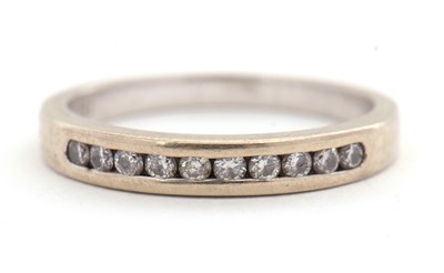 Lot 22 - An 18ct diamond half eternity ring, with...