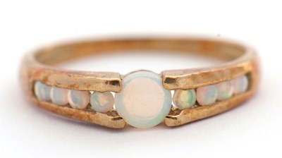 Lot 17 - A 9ct opal ring, with a central round opal...