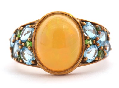 Lot 50 - A 9ct opal, topaz and green stone ring, the...