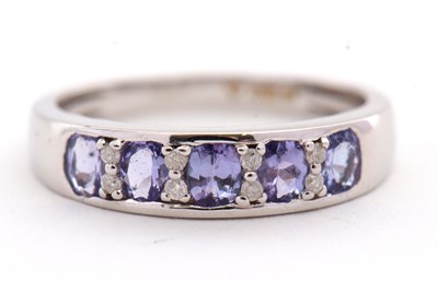 Lot 31 - An 18ct tanzanite and diamond ring, with...