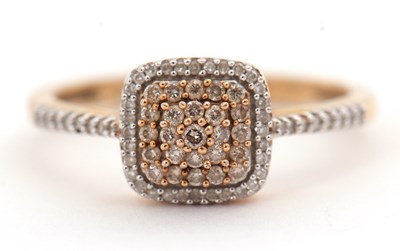 Lot 16 - A 9ct diamond cluster ring, with a central...