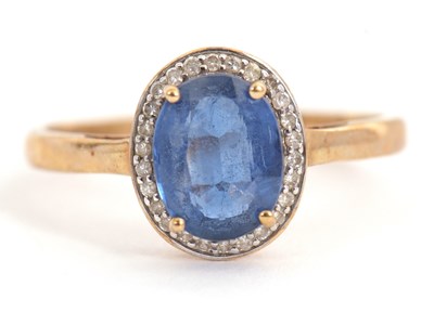 Lot 11 - A 9ct kyanite and diamond ring, the oval...
