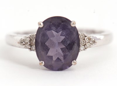 Lot 3 - A 9ct amethyst and diamond ring, the oval...