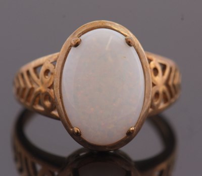 Lot 14 - A 9ct opal ring, with oval opal cabochon in...