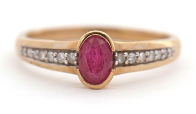 Lot 9 - A 9ct ruby and diamond ring, with central oval...