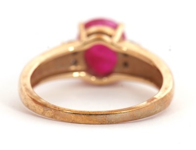 Lot 39 - A 9ct ruby and diamond ring, the oval ruby...