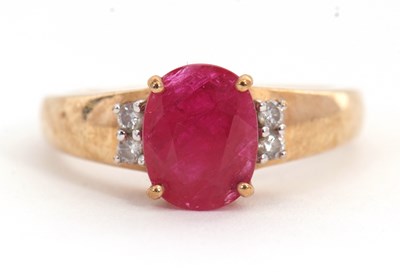 Lot 39 - A 9ct ruby and diamond ring, the oval ruby...