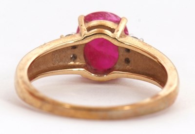 Lot 39 - A 9ct ruby and diamond ring, the oval ruby...