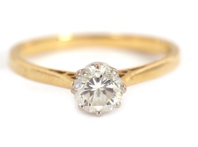 Lot 54 - An 18ct diamond solitaire ring, the round...