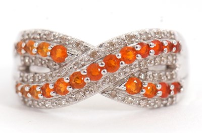 Lot 12 - A 9ct fire opal and diamond ring, set with a...