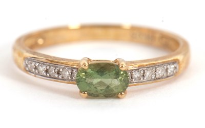 Lot 41 - A 9ct apatite and diamond ring, the oval...