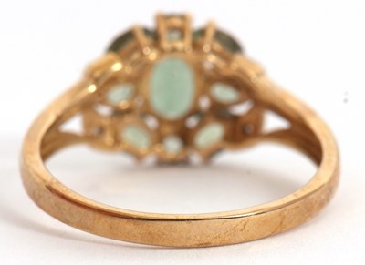 Lot 24 - A 9ct apatite and diamond cluster ring, with...