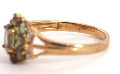Lot 24 - A 9ct apatite and diamond cluster ring, with...
